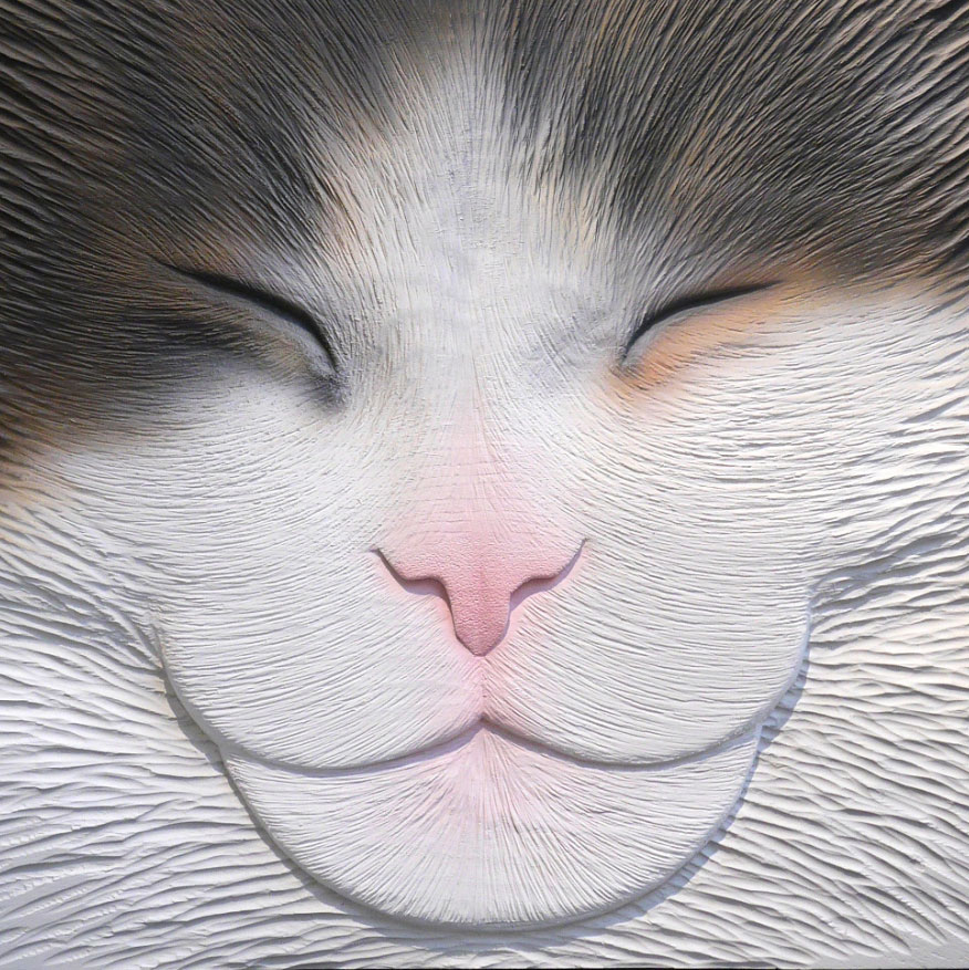 Sculpture: A large cat's face