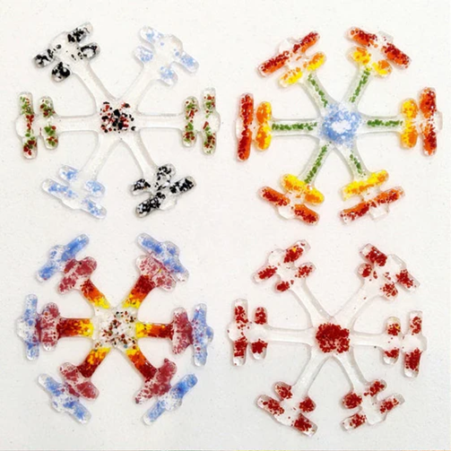 Fused glass snowflakes in a variety of colors
