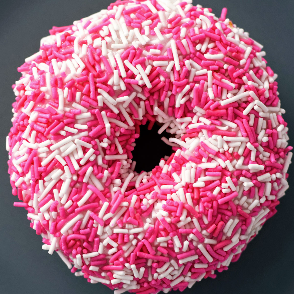 Donut with white and pink sprinkles