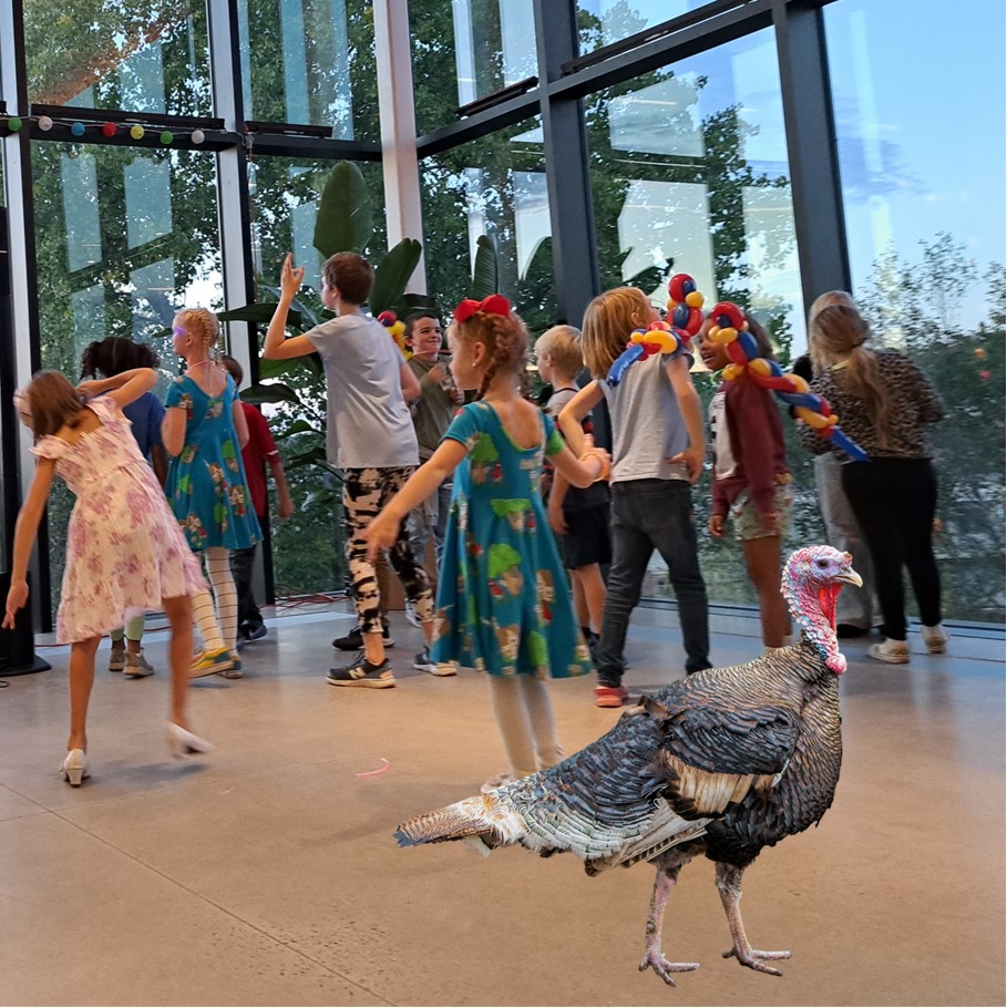 Group of kids dancing, a turkey in the foreground