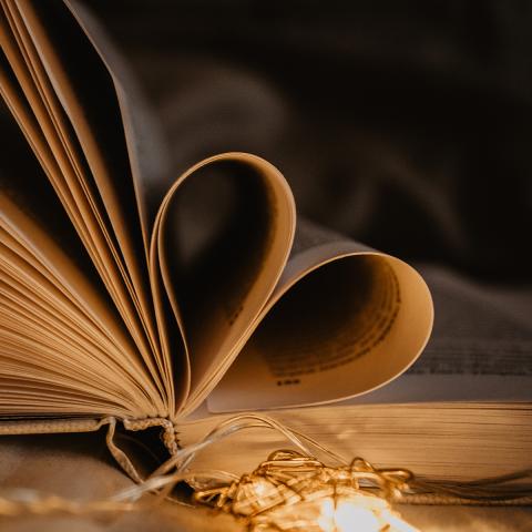 Book with pages curved into a heart