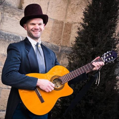 Man holding a guitar 