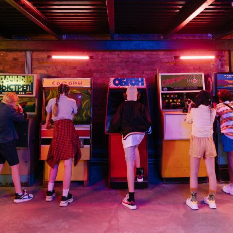 teens playing arcade games