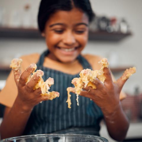 Girl with cookie dough fingers