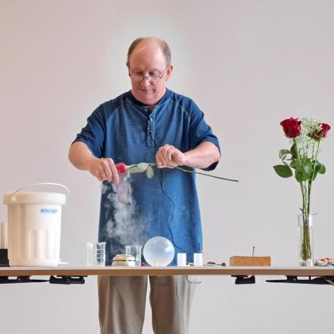 Man dipping items in liquid nitrogen