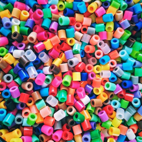 A bunch of colorful little perler beads.