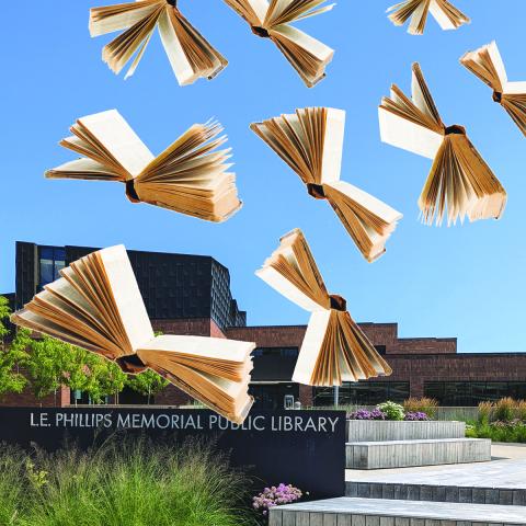 Picture of the library's entrance with books "flying" away using their pages as wings.