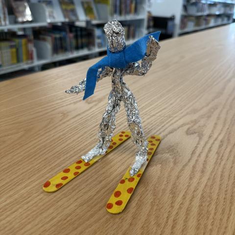 Little skier figure made out of tinfoil. 