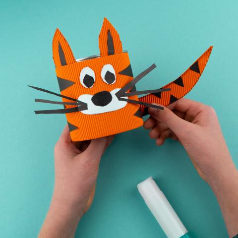 Toy tiger made from paper and glue.