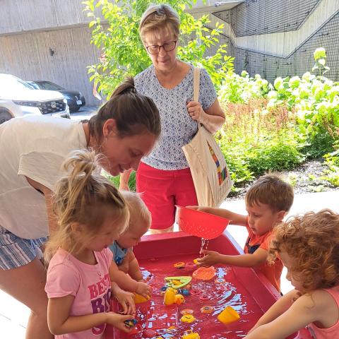 Group of kids playing in water. 