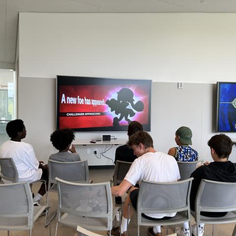 Group of teens playing Nintendo Switch. 