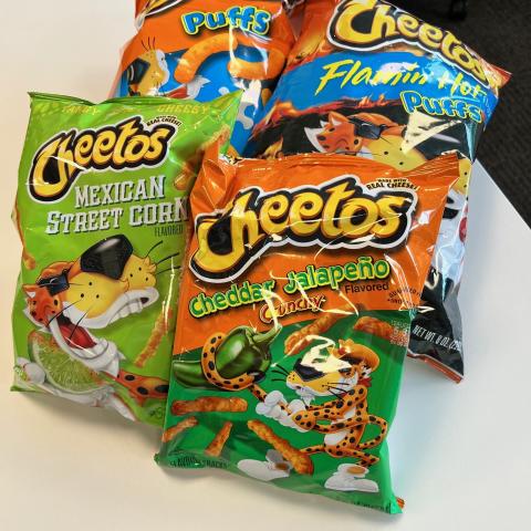 Four bags of Cheetos in various flavors