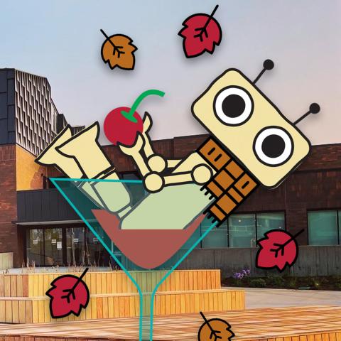 The Dabble Box's robot mascot sitting in a cocktail glass in front of the library.