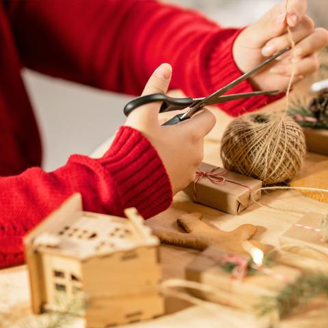 A photograph of a child doing festive crafts