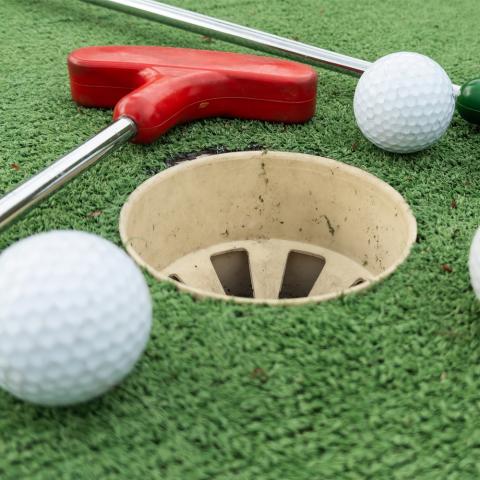 A photograph of mini golf green.