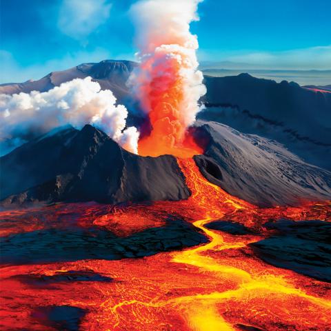 A volcano exploding lava.