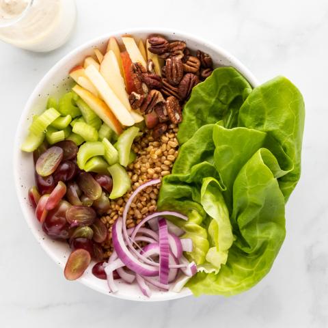 A photograph of a leafy green salad. 