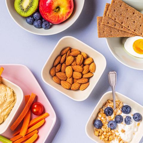 A photograph of a variety of snacks displayed on a table top.