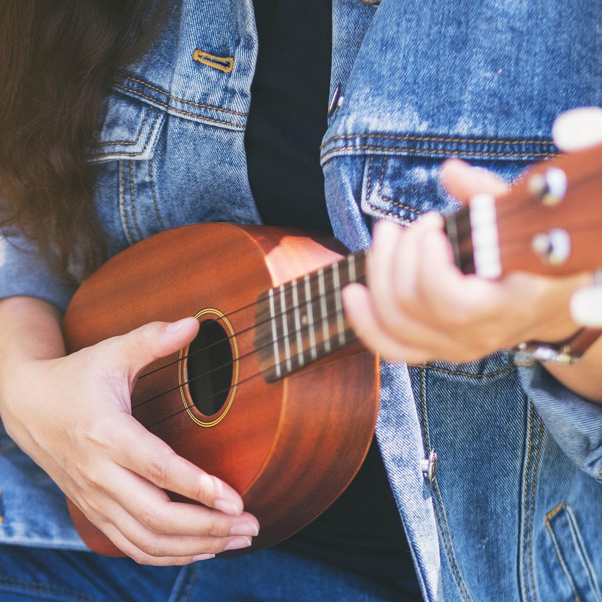 Woman playing a ukulele