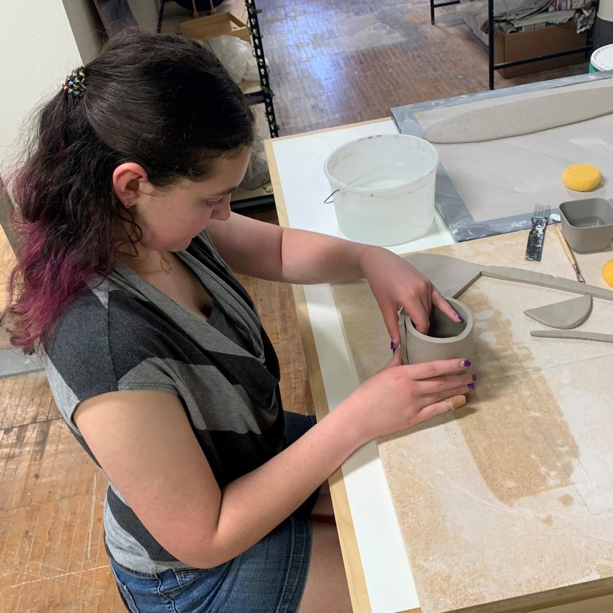 Teen working with clay