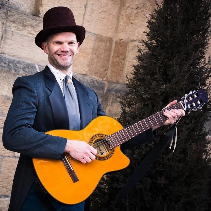 Man holding a guitar 