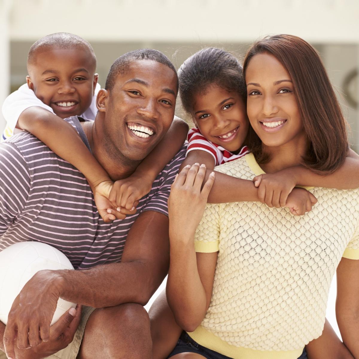 Smiling family of four