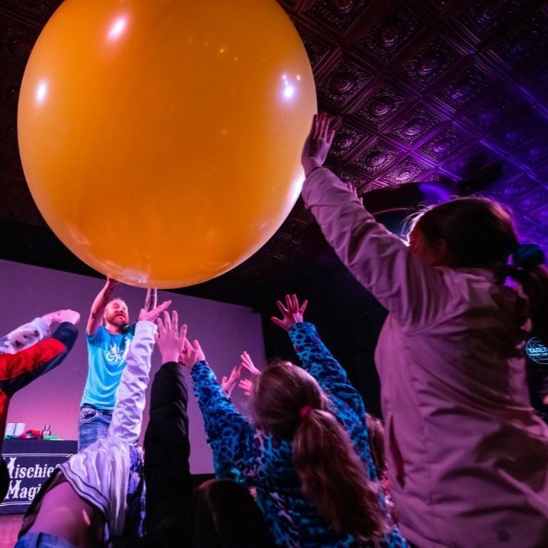 Children with giant balloon.