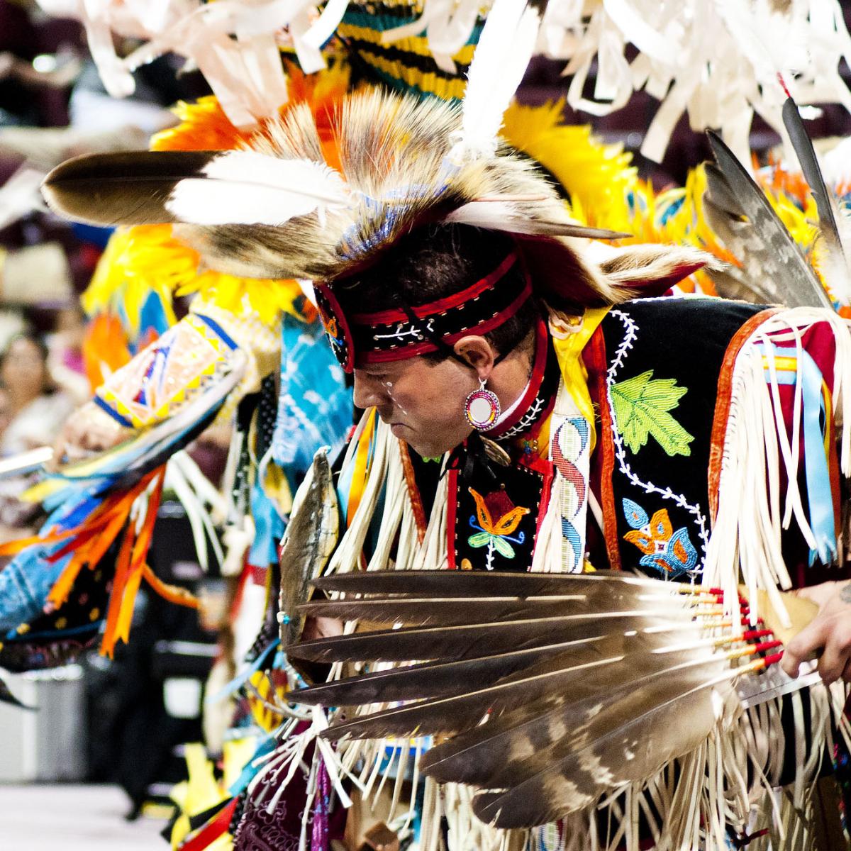 man dancing at powwow