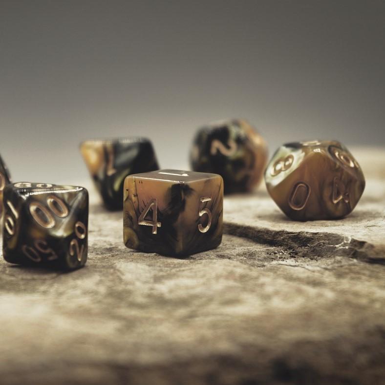 Five dice sitting on a table.