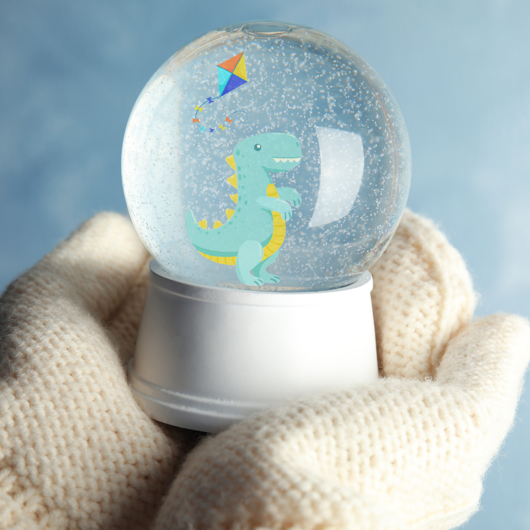 Hands in mittens cradle a snow globe.