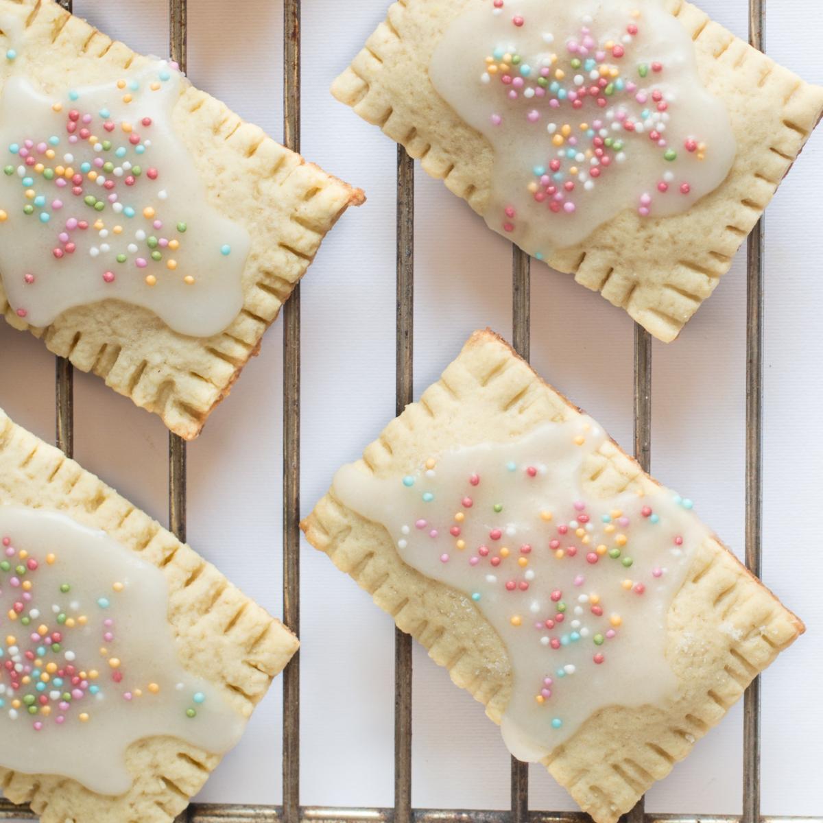 Pop-Tart pastries sitting on a cooling rack. 