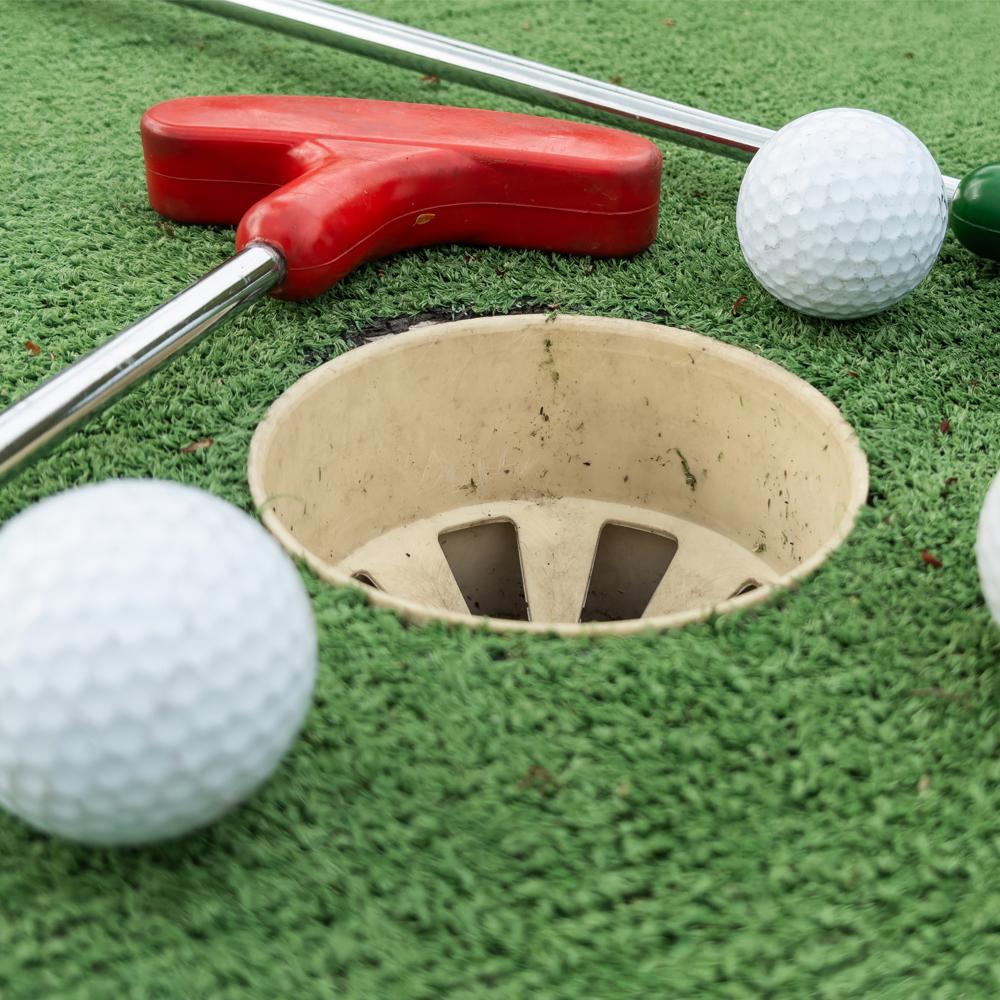 A photograph of mini golf green.
